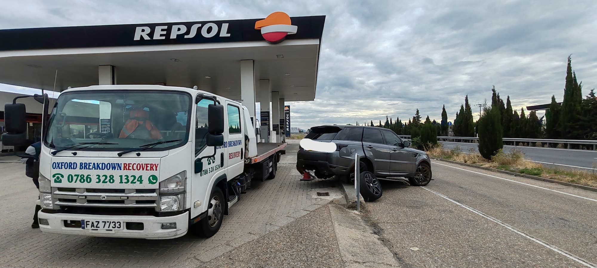 Accident-damaged Range Rover Sport with detached wheel recovered from Spain